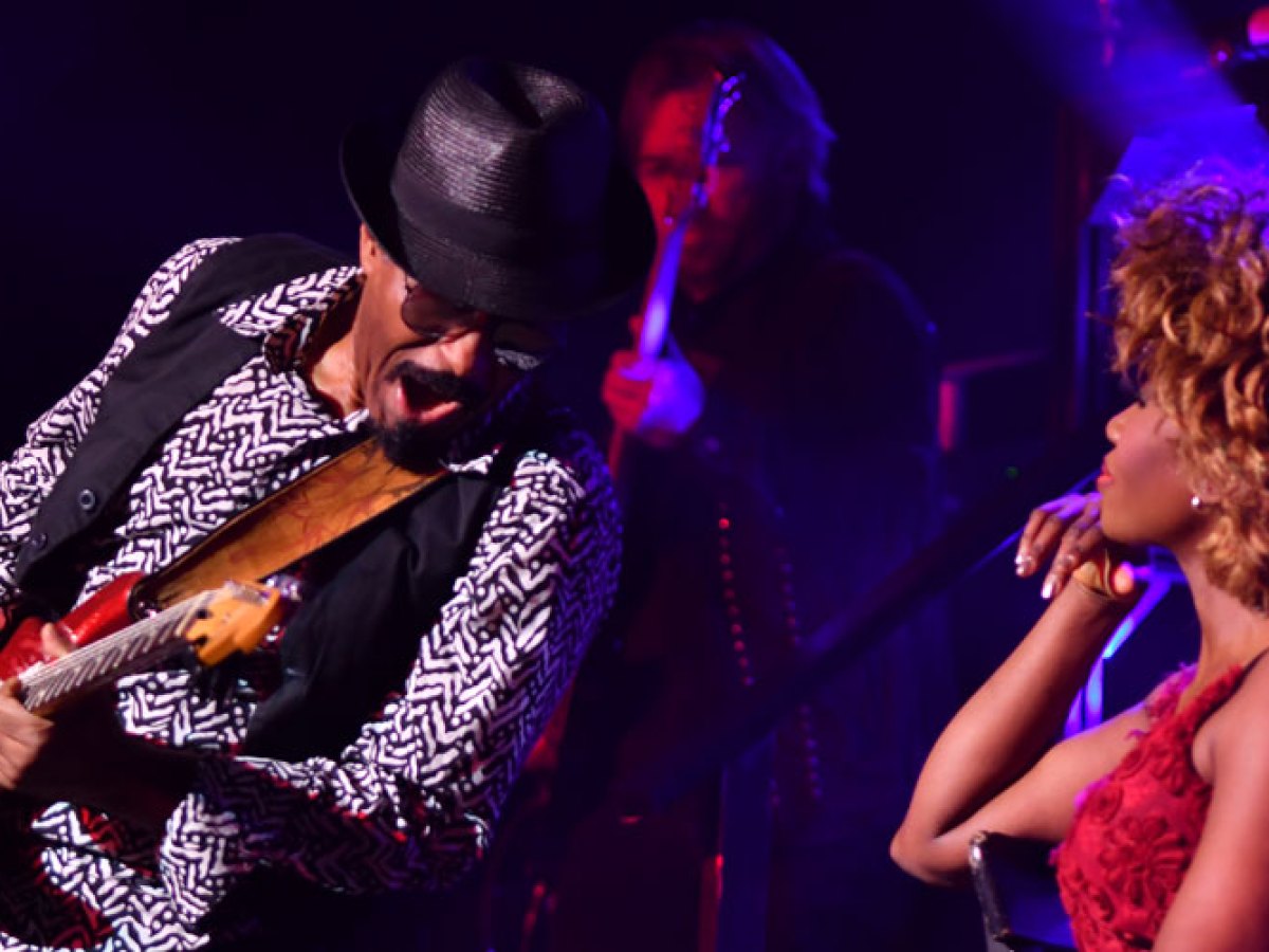 a man sitting on a stage