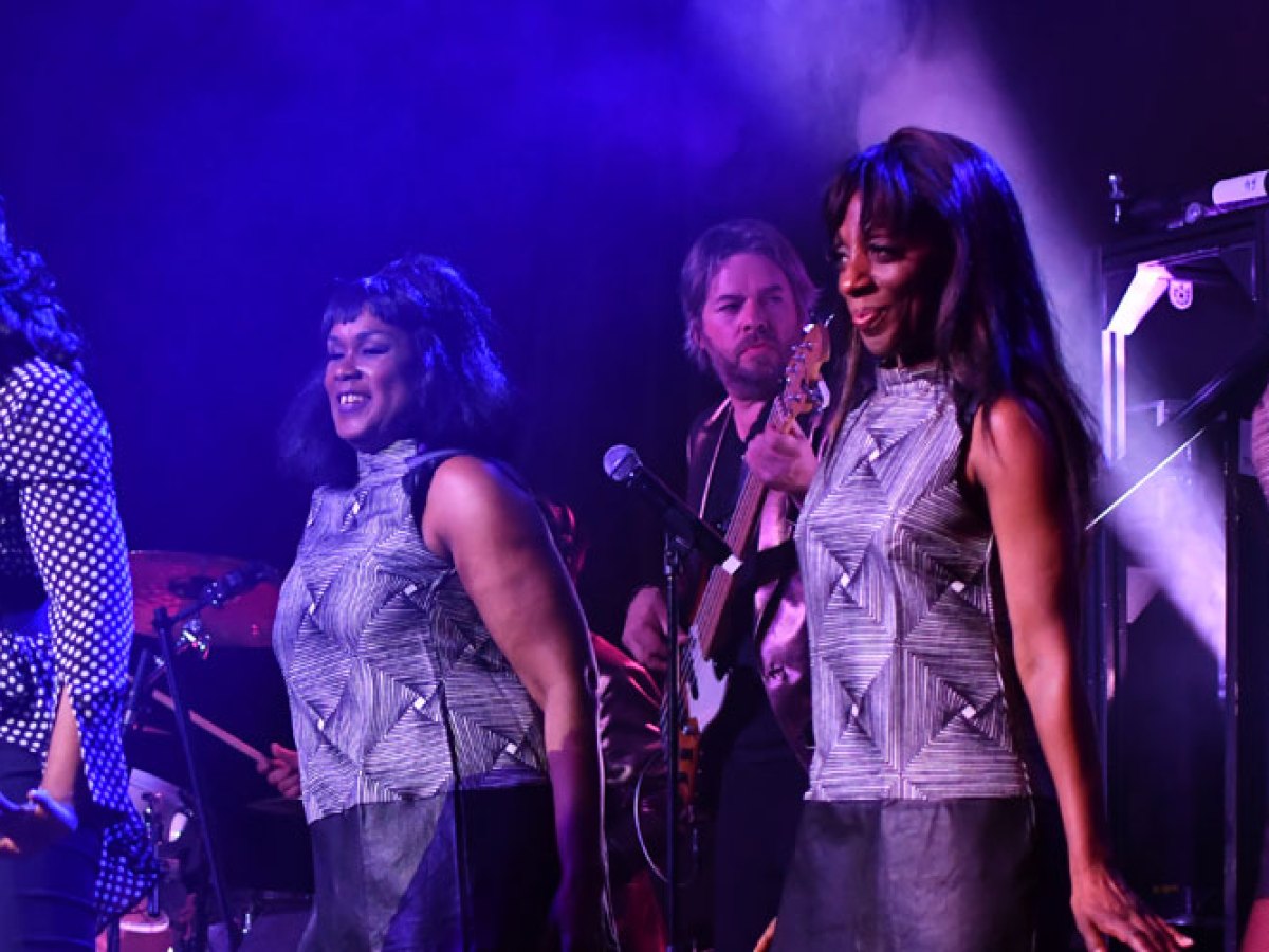 a group of people standing on a stage