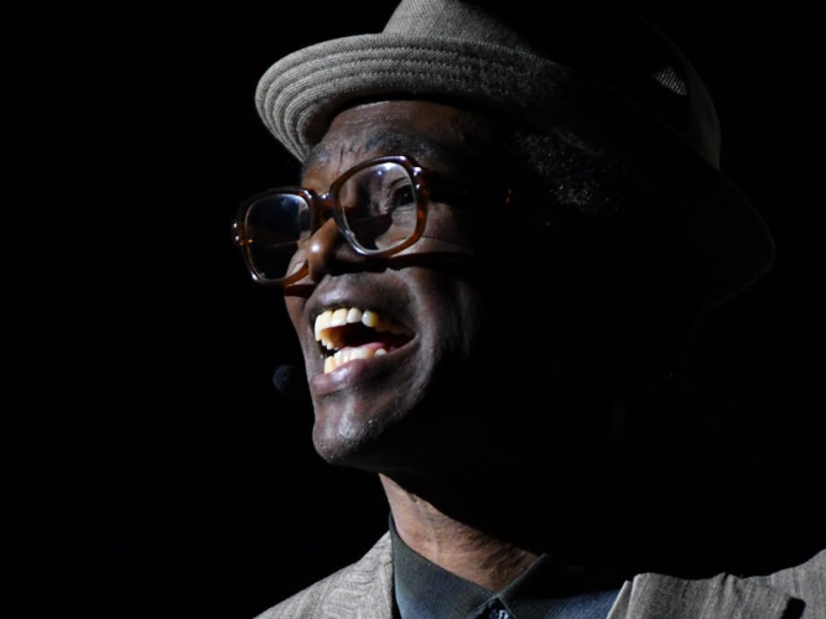 a man wearing a hat and glasses