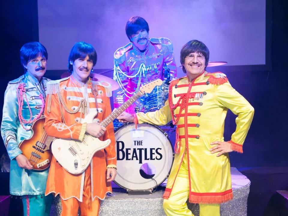 a couple of people that are sitting on a stage