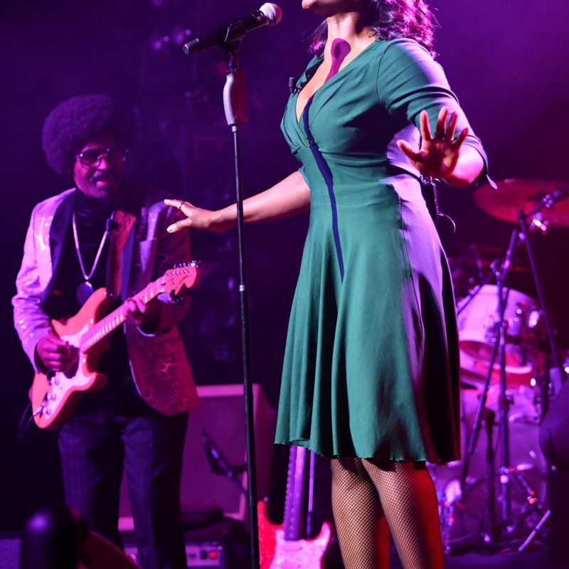 a man and a woman standing on a stage