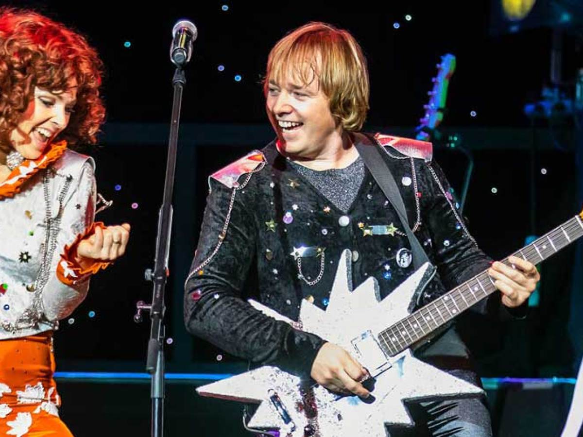 a person holding a guitar