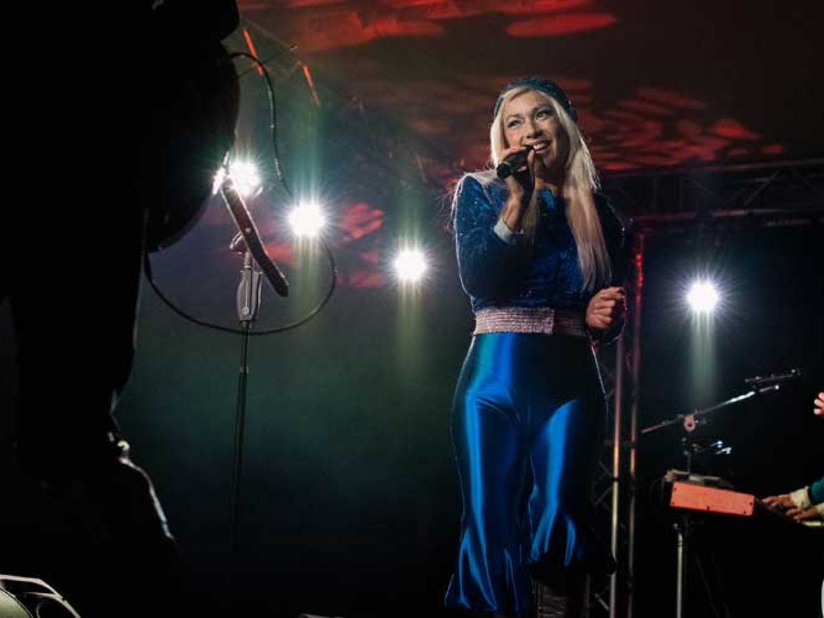 a man and a woman standing on a stage
